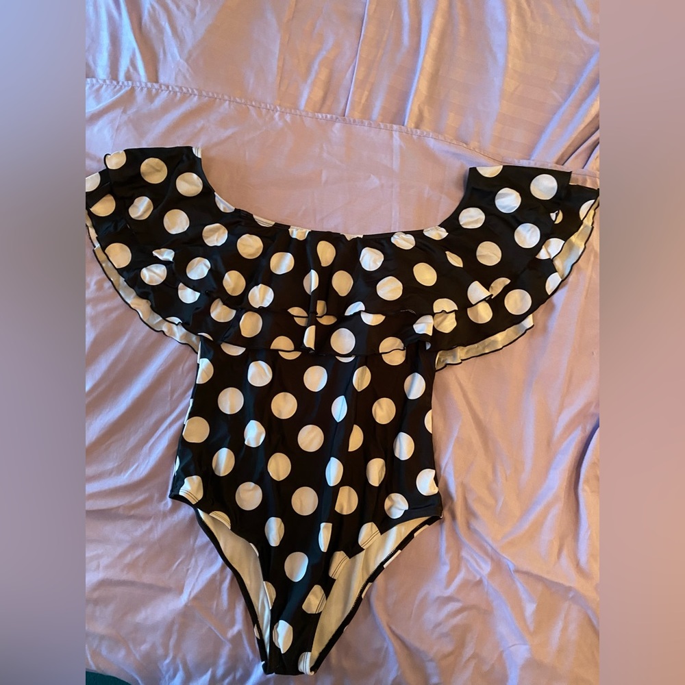 Bathing suit of ruffles & polka dots. Sexy& fun! Figure flattering. Never worn.